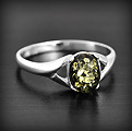 Bague Ambre Argent Iwona - BGAG-554 Très jolie bague en argent formée d'une monture travaillée et d'une belle ambre véritable de la...