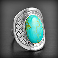 Très belle bague tressée en argent ornée d'une jolie turquoise véritable sertie (h:28mm).