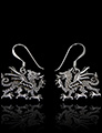 Boucles d'oreilles en argent massif en très beaux dragons en relief sur une face (h:15mm).