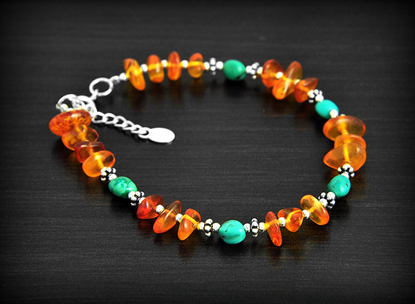 Superbe bracelet baroque en argent composé d'ambre et turquoise véritables, longueur réglable en...