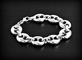 Bracelet très chic en argent, modèle maille grain de café de taille moyenne avec polissage...