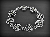 Bracelet celtique en argent de triskel ornés des trois couleurs d'ambre (cognac, miel et vert)...