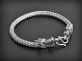 Magnifique bracelet en argent avec maille indonésienne, orné de 2 têtes de dragon en volume au...