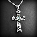 Joli pendentif en argent d'une croix celtique ajourée et orné d'une pierre de topaze bleue,...